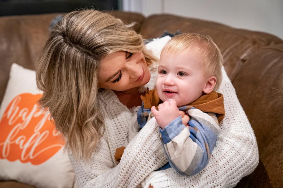  Jeanna Trotman, the new weekend sports anchor and reporter at WXYZ in Detroit, snuggles with her 11-month-old son Luca at their Berkley home Tuesday, Nov. 16, 2021.