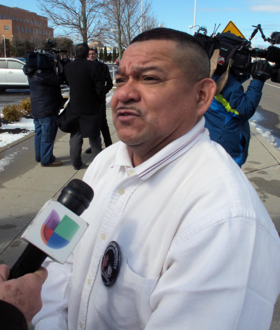 In this Monday, March 31, 2014 photo, Oscar Argueta speaks to the media outside the U.S. District Courthouse in Central Islip, N.Y. Argueta attended the arraignment of Juan Elias Garcia, who is accused of murdering Argueta's daughter, Vanessa, and her 2-year-old son Diego Torres. Garcia, who was on the FBI's list of "Ten Most Wanted Fugitives" until his capture in Nicaragua last week, pleaded not guilty and is being held without bail. (AP Photo/Frank Eltman)