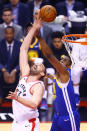 Marc Gasol #33 of the Toronto Raptors and Kevon Looney #5 of the Golden State Warriors battle for the rebound in the first quarter during Game One of the 2019 NBA Finals at Scotiabank Arena on May 30, 2019 in Toronto, Canada. (Photo by Vaughn Ridley/Getty Images)