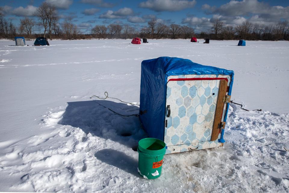 Ice fishing huts sit on a frozen Misery Bay in Presque Isle State Park in Erie County.