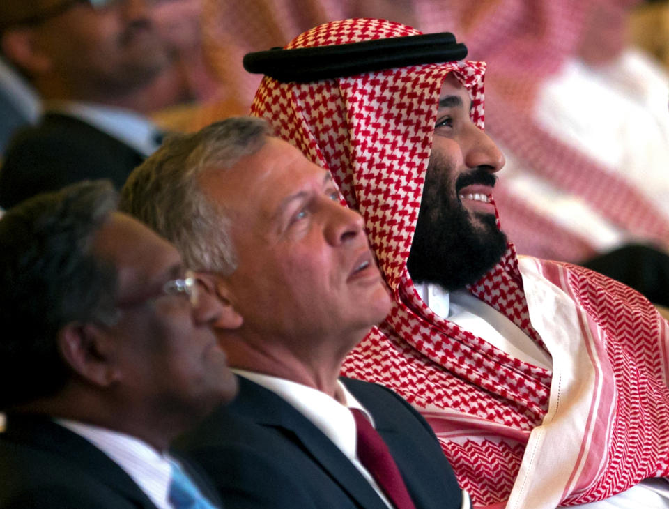 Saudi Crown Prince, Mohammed bin Salman, right, Jordan's King Abdullah II, center and former Maldives President Mohammed Waheed Hassan, attend the Future Investment Initiative conference, in Riyadh, Saudi Arabia, Tuesday, Oct. 23, 2018. The high-profile economic forum in Saudi Arabia is the kingdom's first major event on the world stage since the killing of writer Jamal Khashoggi at the Saudi Consulate in Istanbul earlier this month. (AP Photo/Amr Nabil)