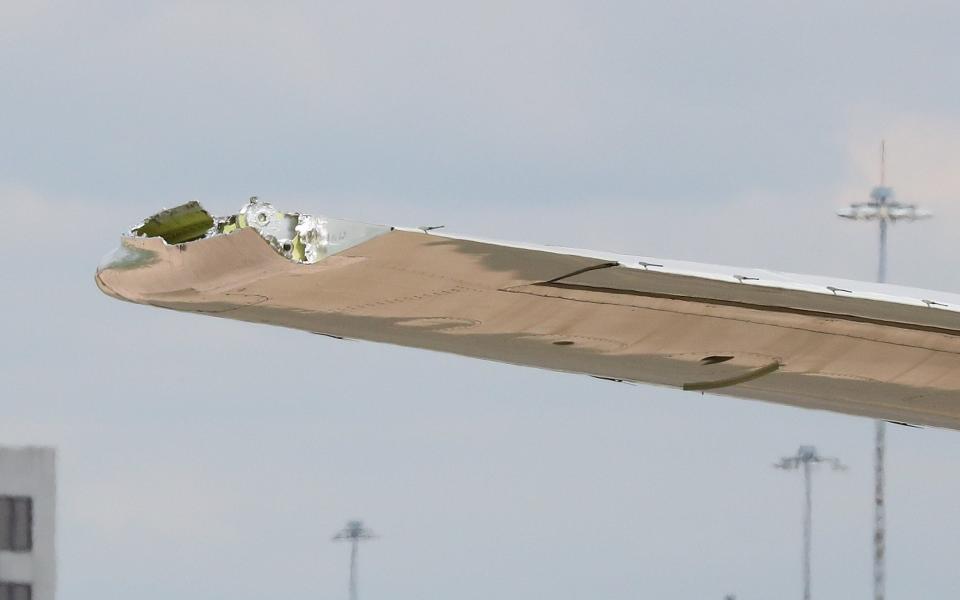 Thomas Cook flight turned back and made an emergency landing back at Manchester Airport with the tip of one of its wings missing  - Credit: Eamonn and James Clarke 