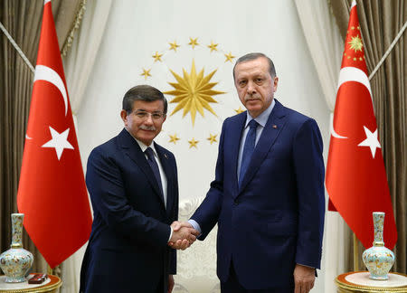 Turkish President Tayyip Erdogan (R) meets with outgoing Prime Minister Ahmet Davutoglu at the Presidential Palace in Ankara, Turkey, May 22, 2016. Kayhan Ozer/Presidential Palace/Handout via REUTERS