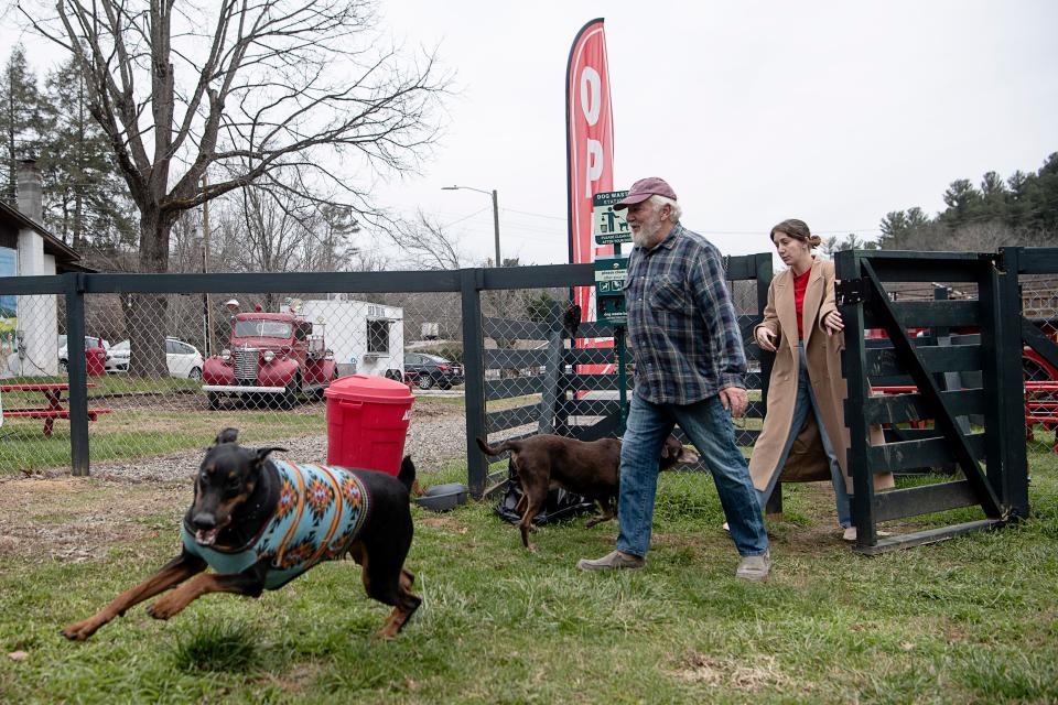 Matt Sperling and his daughter, Lauren, at the West End Paw Park with their dogs, Wilson, left, and Zooey, center, December 20, 2022.