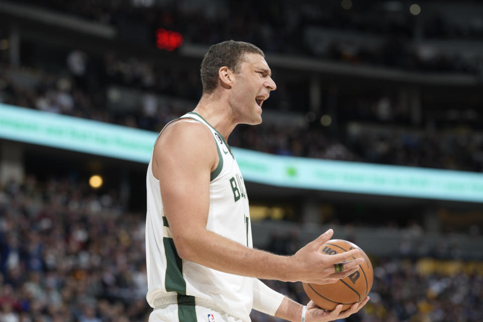 Milwaukee Bucks center Brook Lopez reacts after being called for a foul on Denver Nuggets center Nikola Jokic in the first half of an NBA basketball game Saturday, March 25, 2023, in Denver. (AP Photo/David Zalubowski)