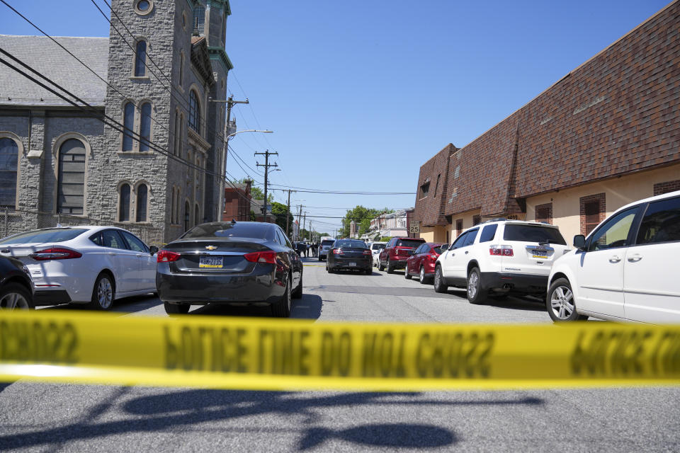 Police tape cordons off the scene of a fatal shooting at Delaware County Linen in Chester, Pa., Wednesday, May 22, 2024. Authorities say a former employee armed with a handgun opened fire at a linen company in a Philadelphia suburb, killing multiple people and wounding three others. (AP Photo/Matt Rourke)