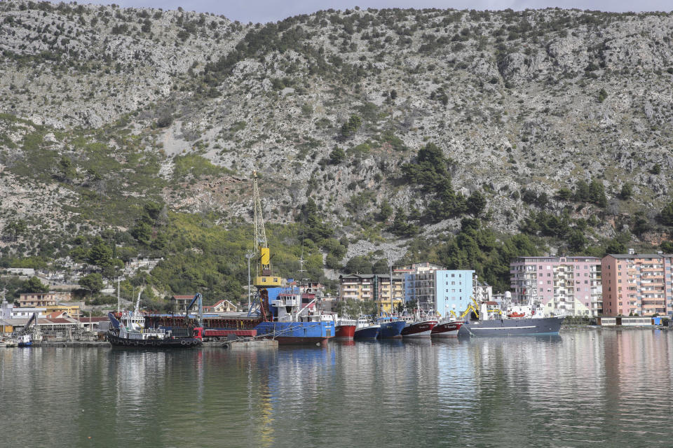 Vessels are docked at the port of Shengjin, northwestern Albania, on Tuesday, Nov. 7, 2023. Italian Premier Giorgia Meloni announced that Albania had agreed to give temporary shelter to thousands of migrants who try to reach Italian shores while their asylum bids are being processed. Albania will offer two facilities, a quarantine area at the port of Shengjin and an accommodation center for those who will be deported at a former military airport in Gjader. (AP Photo/Armando Babani)