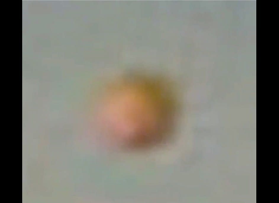 This is a closeup of the UFO from the previous slide. No official explanation has been offered about the object.