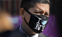 New York City Schools Chancellor Richard Carranza wears a mask during a news conference at the Mosaic Pre-K Center on the first day of school, Monday, Sept. 21, 2020, in New York. The city public schools delayed reopening for two weeks. (AP Photo/Mark Lennihan)