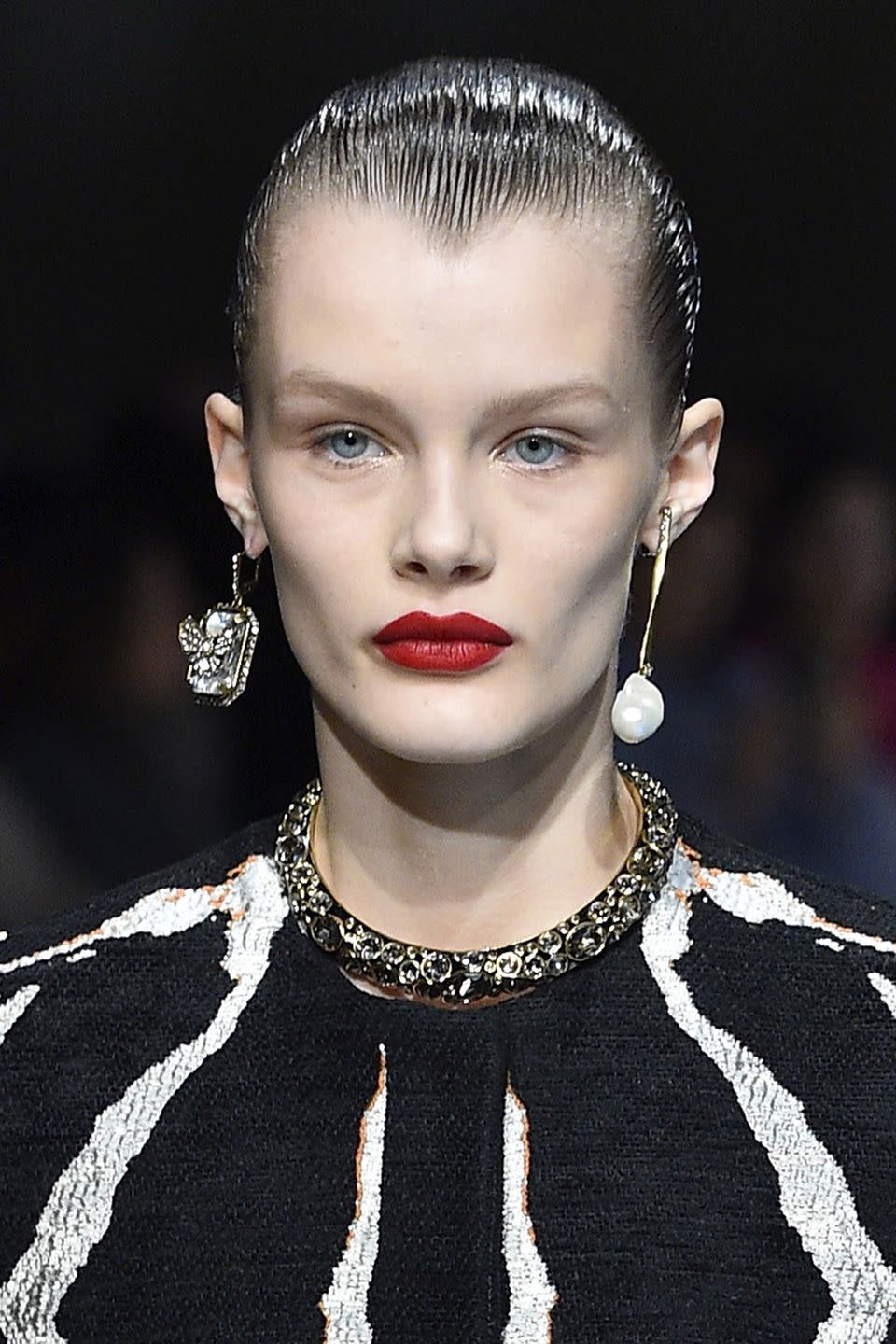 <p><strong>Trend: bold red lips</strong></p><p>For the Alexander McQueen show, the dramatic nature of the red lipstick was enhanced not only by a satin finish but because the rest of the make-up was completely pared back. </p>