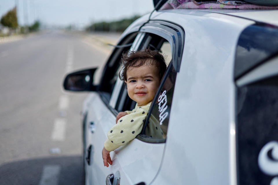 The daughter Raghda Abu Marasa, who fled after Israel called for more than 1 million civilians in the Gaza Strip to move south, in a car with her family as they return to their home in Gaza City on Tuesday. 