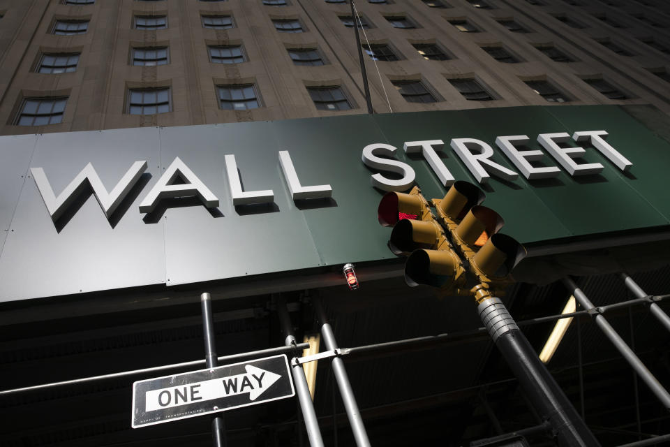 FILE - A sign for a Wall Street building is shown, Tuesday, June 16, 2020. About 1 in 5 American workers, including retail and construction workers, are bound by noncompete agreements, according to the Federal Trade Commission. New York Gov. Kathy Hochul hasn't said whether she intends to sign state legislation passed last June that would ban noncompete agreements. The legislation has come under a fierce attack by business groups. (AP Photo/Mark Lennihan, File)