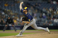 Milwaukee Brewers starting pitcher Brandon Woodruff works against a San Diego Padres batter during the first inning of a baseball game Monday, April 19, 2021, in San Diego. (AP Photo/Gregory Bull)