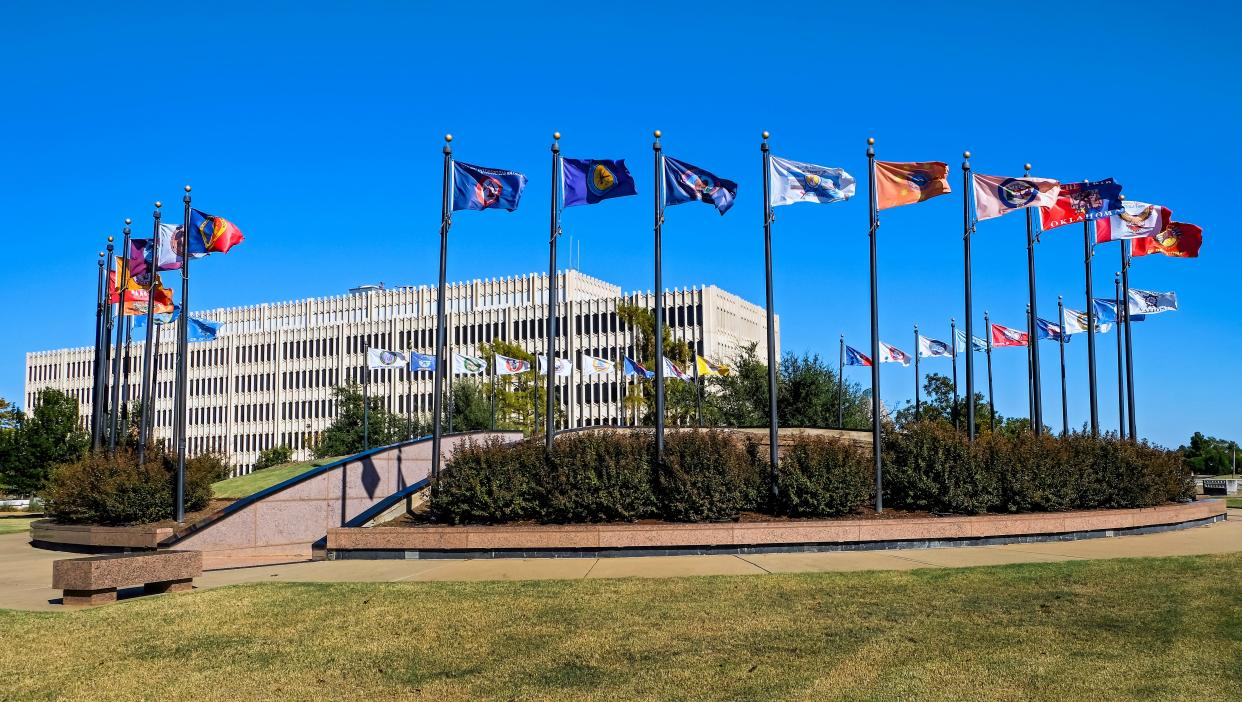 Flags representing 35 tribal nations fly in the Tribal Flag Plaza just north of the Oklahoma Capitol building. The display was finished in 1996, eight years after it was proposed.