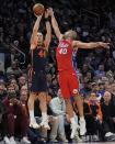 Philadelphia 76ers' Nicolas Batum (40) defends against a shot by New York Knicks' Bojan Bogdanovic (44) during the second half of Game 2 in an NBA basketball first-round playoff series Monday, April 22, 2024, in New York. (AP Photo/Frank Franklin II)