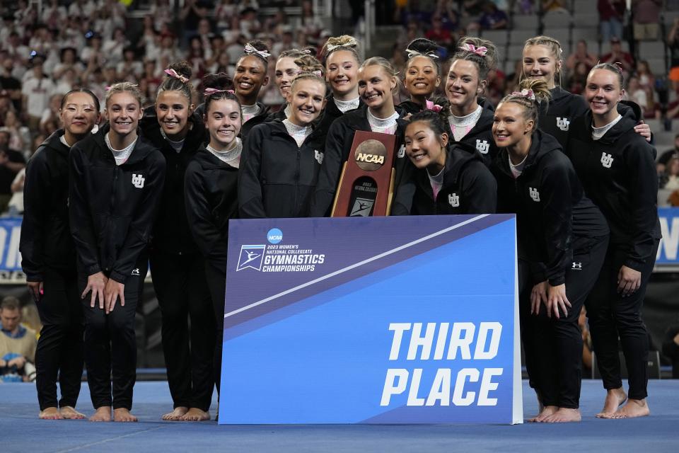 Utah gymnasts pose with the trophy after finishing third at the NCAA women’s gymnastics championships Saturday, April 15, 2023, in Fort Worth, Texas. | Tony Gutierrez, Associated Press