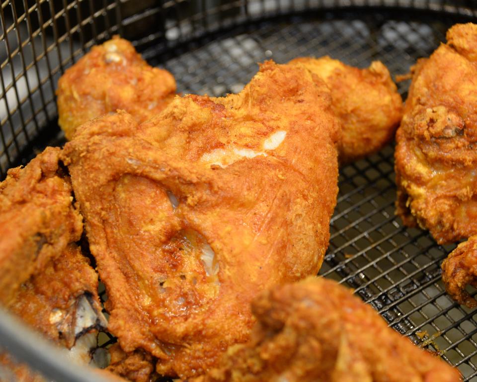 Pieces of fried chicken sit draining in the fry basket at the AC&T Travel Plaza on Hopewell Road. Hagerstown-based AC&T was picked by Herald-Mail readers recently as having the best gas station food in the Tri-State region.