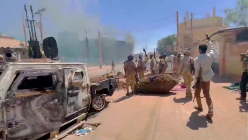 FILE PHOTO: RSF fighters stand near the damaged Air Defence Forces command centre in Khartoum