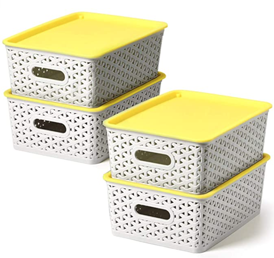 four containers with yellow lids
