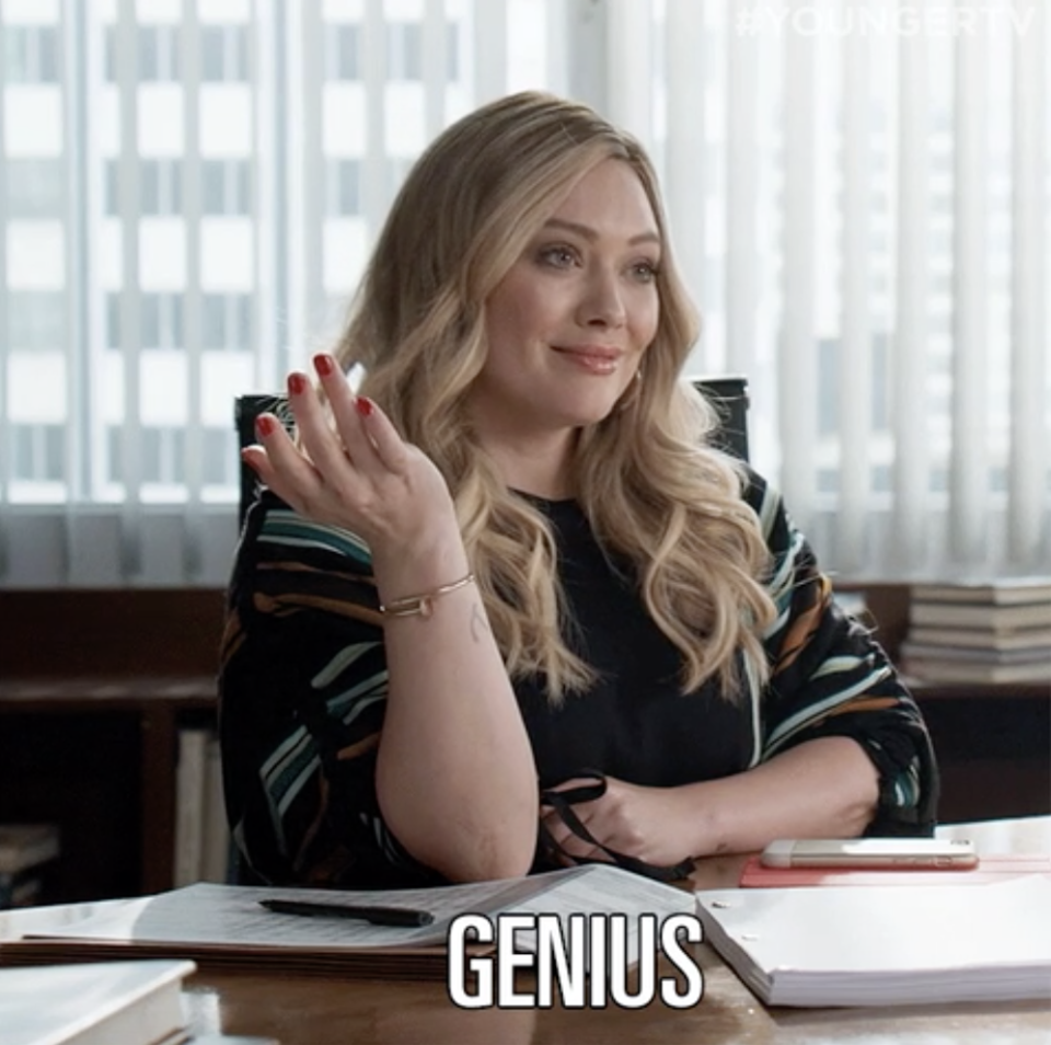 a woman saying, "genius"