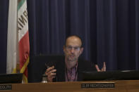 California Public Utilities Commissioner Cliff Rechtschaffen speaks at a CPUC meeting in San Francisco, Wednesday, Nov. 13, 2019. California regulators will vote Wednesday on whether to open an investigation into pre-emptive power outages that blacked out large parts of the state for much of October as strong winds sparked fears of wildfires. (AP Photo/Jeff Chiu)