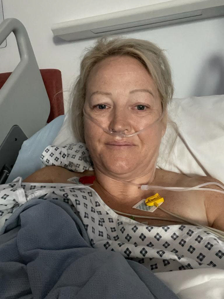 Donna in hospital after donating her kidney to her husband. (SWNS)