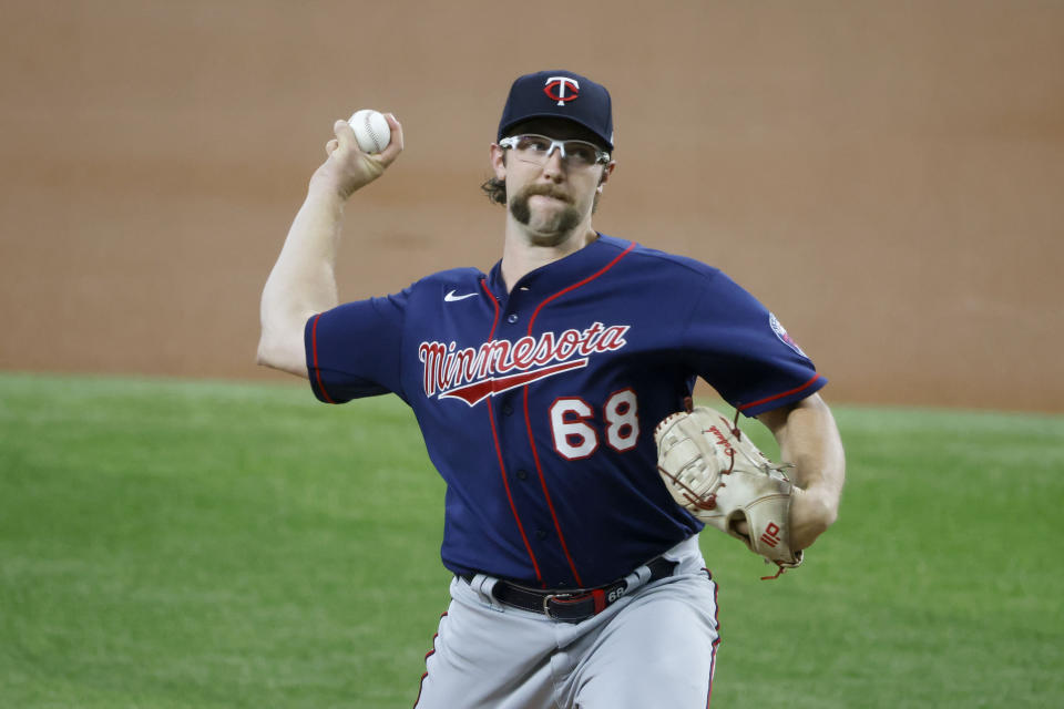 Minnesota Twins starting pitcher Randy Dobnak throws against the Texas Rangers during the first inning of a baseball game Saturday, June 19, 2021, in Arlington, Texas. (AP Photo/Michael Ainsworth)