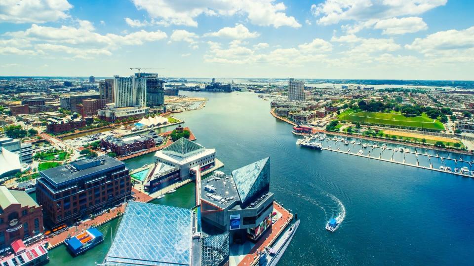 Aerial view of the Inner Harbor of Baltimore, Maryland on a clear summer day.