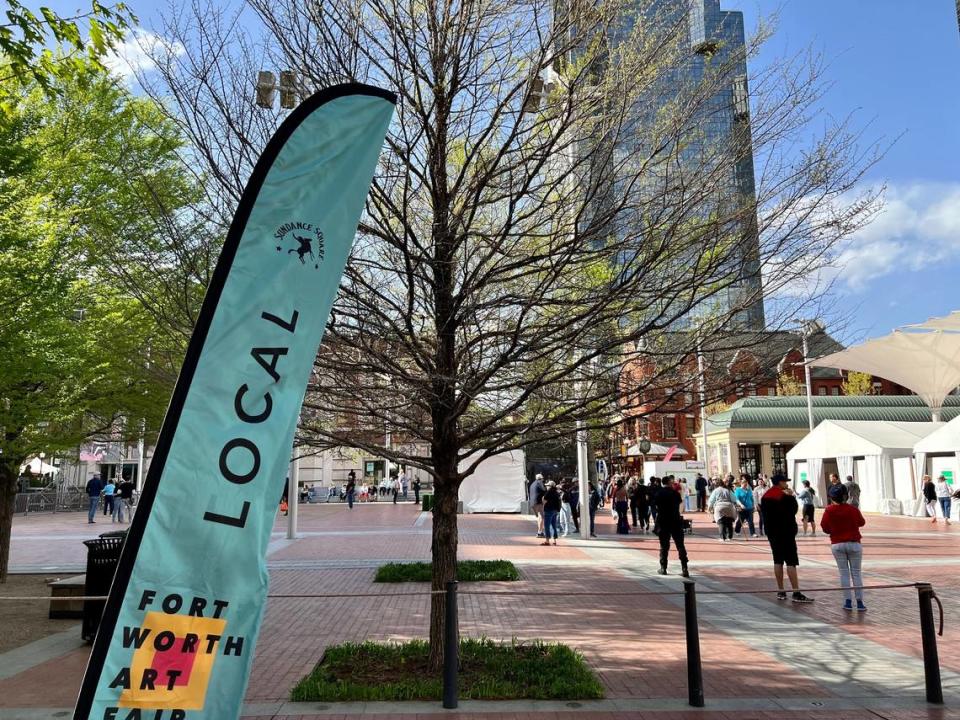 “Local” signs defined the Fort Worth Art Fair in Sundance Square Plaza as an event for hometown artists, as opposed to the touring artists selected for the Main Street Fort Worth Arts Festival.