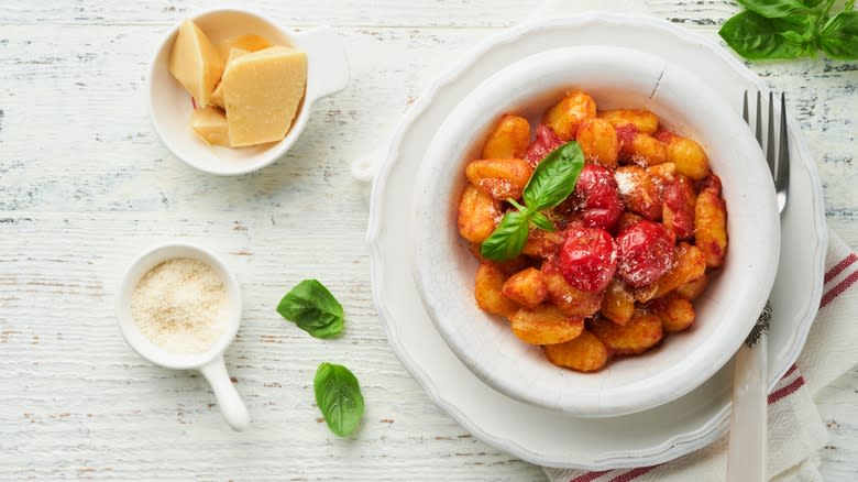 Gnocchi in bowl on white