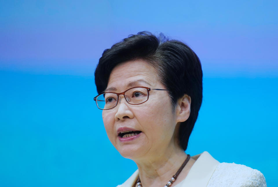 Hong Kong Chief Executive Carrie Lam speaks during a news conference in Hong Kong, Tuesday, May 11, 2021. Lam announced Hong Kong officials have dropped a plan to make it mandatory for foreign domestic workers to be vaccinated against the coronavirus, after the move drew criticism that it was discriminatory. (AP Photo/Vincent Yu)