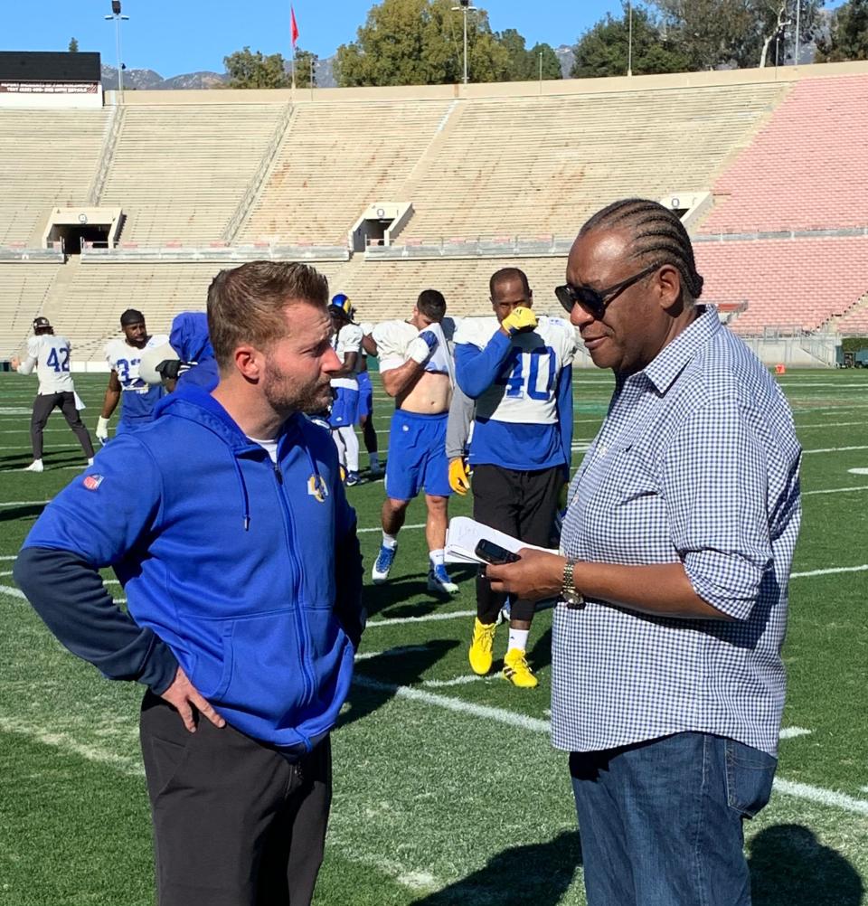 Jarrett Bell speaks with Rams coach Sean McVay during a Super Bowl week practice.