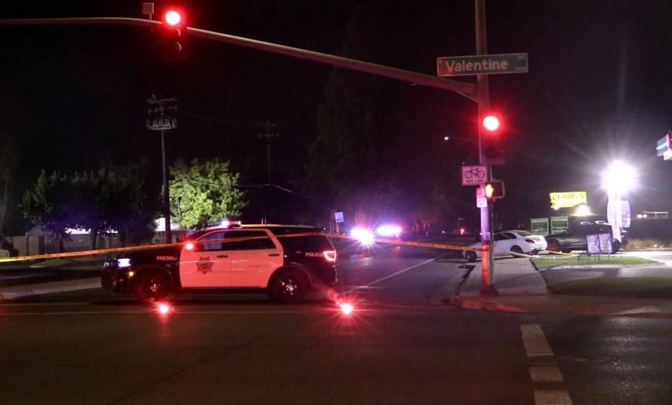 Officers block off a section of Ashlan Avenue between Valentine and Feland avenues on Tuesday, Oct. 3, 2023, after a fatal collision with a pedestrian, Fresno police say.