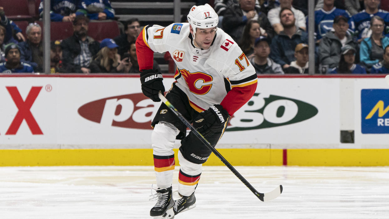 VANCOUVER, BC - FEBRUARY 08: Milan Lucic #17 of the Calgary Flames skates with the puck in NHL action against the Vancouver Canucks at Rogers Arena on February 8, 2020 in Vancouver, Canada. (Photo by Rich Lam/Getty Images)