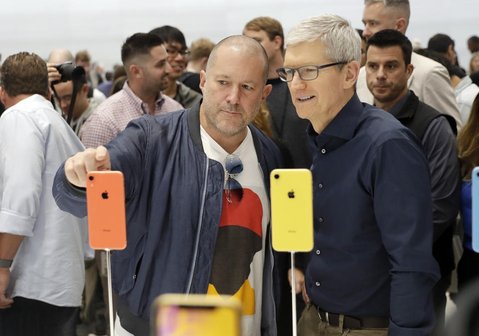 <p>Jonathan Ive, Apple’s chief design officer, left, looks at some new iPhone models with CEO Tim Cook. (AP) </p>