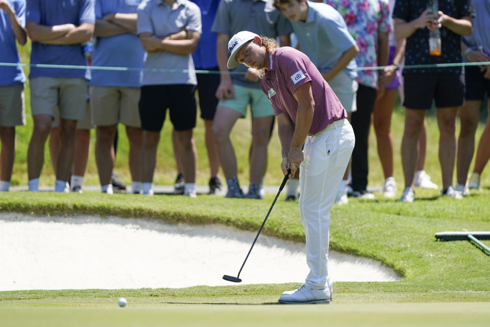 Cameron Smith, of Australia, watches his putt on the fifth green during the final round of the St. Jude Championship golf tournament, Sunday, Aug. 14, 2022, in Memphis, Tenn. (AP Photo/Mark Humphrey)
