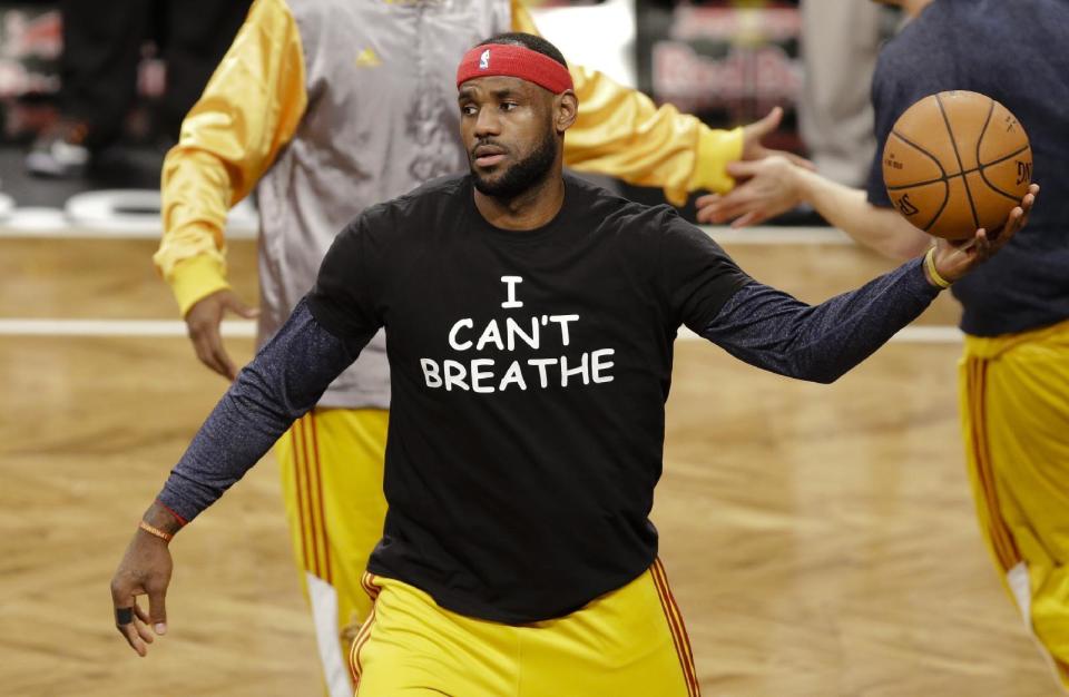 FILE - In this Dec. 8, 2014 file photo, Cleveland Cavaliers&#39; LeBron James wears a T-shirt reading &quot;I Can&#39;t Breathe,&quot; during warms up before an NBA basketball game against the Brooklyn Nets in New York. Celebrities have long played a significant role in social change, from Harry Belafonte marching for civil rights to Muhammad Ali’s anti-war activism. James and other basketball stars made news in 2014 when they wore T-shirts to protest the death of Eric Garner. (AP Photo/Frank Franklin II, File)