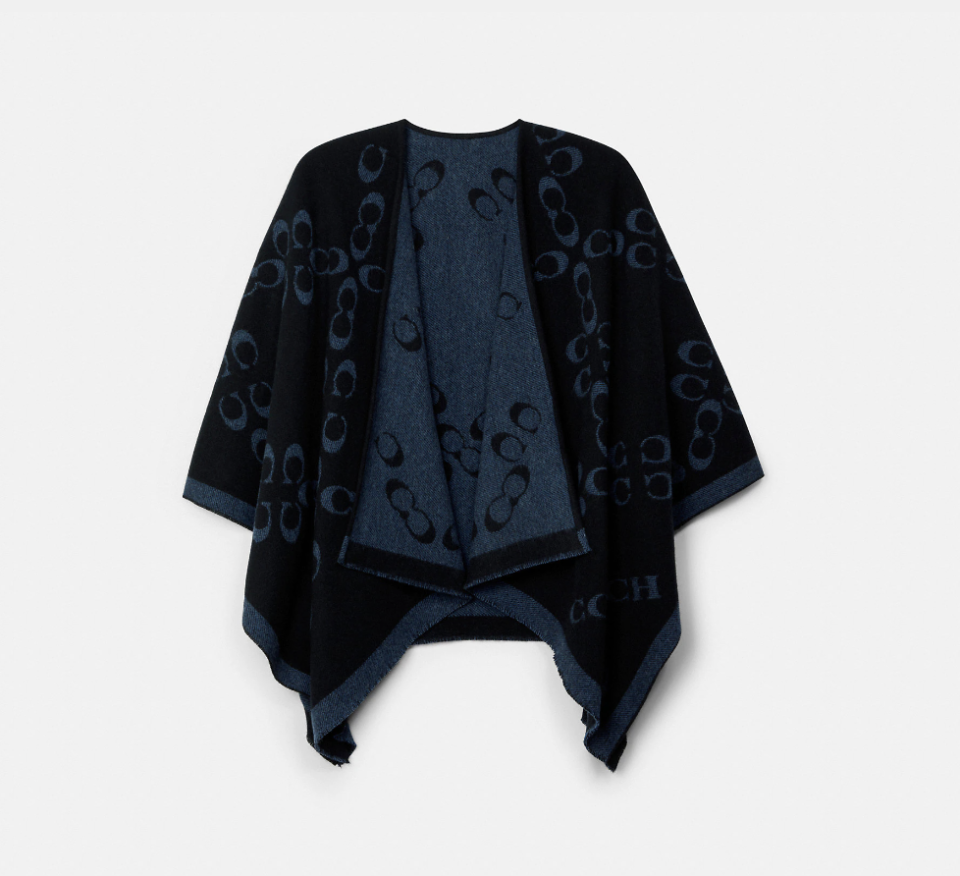 Signature Poncho in black/midnight navy (Photo via Coach Outlet)
