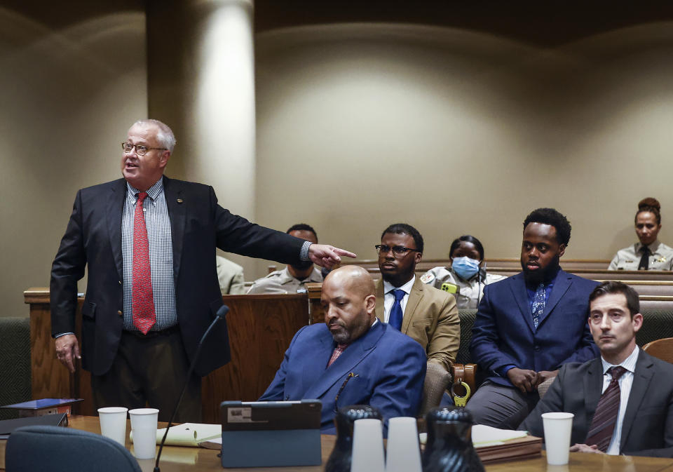 Attorney Martin Zummach, left, points to his client former Memphis police officer Justin Smith, center, during an appearance in Judge James Jones Jr.'s courtroom involving the case of five Memphis police officers charged with fatally beating Tyre Nichols, Friday, Sept. 15, 2023, in Memphis, Tenn. (Mark Weber/Daily Memphian via AP)