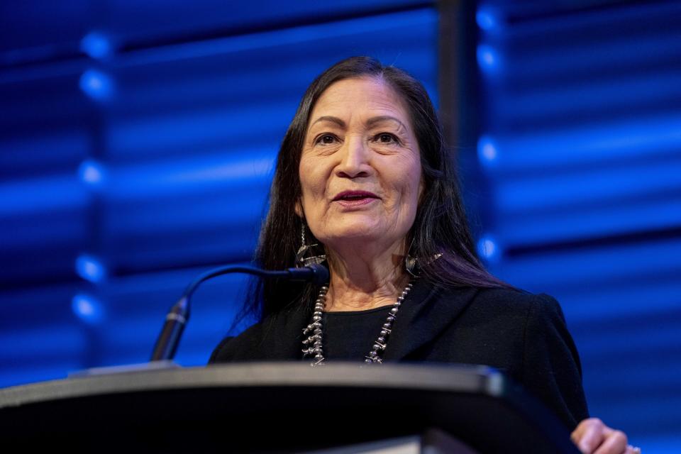 Interior Secretary Deb Haaland announces that her agency will work to restore more large bison herds during a speech for World Wildlife Day at the National Geographic Society in Washington, Friday, March 3, 2023. (AP Photo/Andrew Harnik)