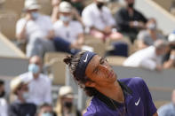 Italy's Lorenzo Musetti reacts after missing a point as he plays against Serbia's Novak Djokovic during their fourth round match on day 9, of the French Open tennis tournament at Roland Garros in Paris, France, Monday, June 7, 2021. (AP Photo/Michel Euler)