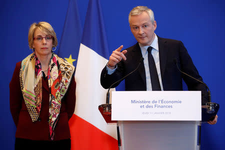 French Finance Minister Bruno Le Maire (R) speaks during a news conference about Lactalis baby milk contamination scandal next to Virginie Beaumeunier, head of the Competition Policy, Consumer Affairs and Fraud Control Agency (DGCCRF), at the Bercy Finance Ministry in Paris, France, January 11, 2018. REUTERS/Christian Hartmann