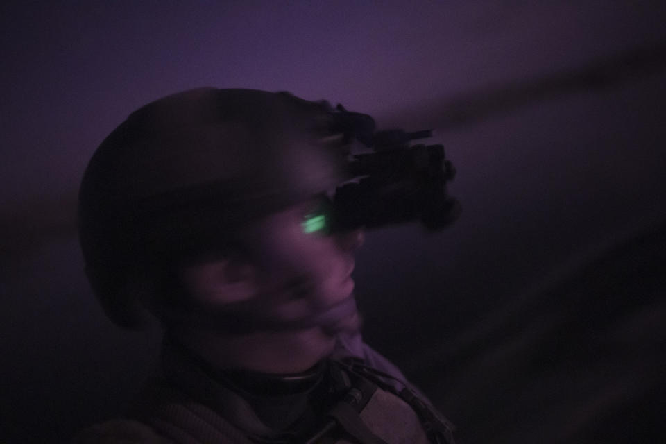 A Ukraine Special Operations Forces soldier navigates the Dnipro River using night vision goggles, or NVG, during a night mission in Kherson region, Ukraine, Saturday, June 10, 2023. (AP Photo/Felipe Dana)