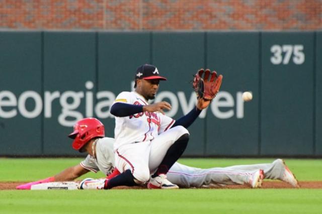 National League's Ozzie Albies, of the Atlanta Braves, throws