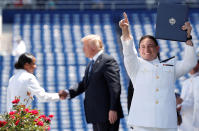 <p>A graduate celebrates after being congratulated by U.S. President Donald Trump at the commissioning and graduation ceremony for U.S. Naval Academy Class of 2018 at the Navy-Marine Corps Memorial Stadium in Annapolis, Md., May 25, 2018. (Photo: Kevin Lamarque/Reuters) </p>