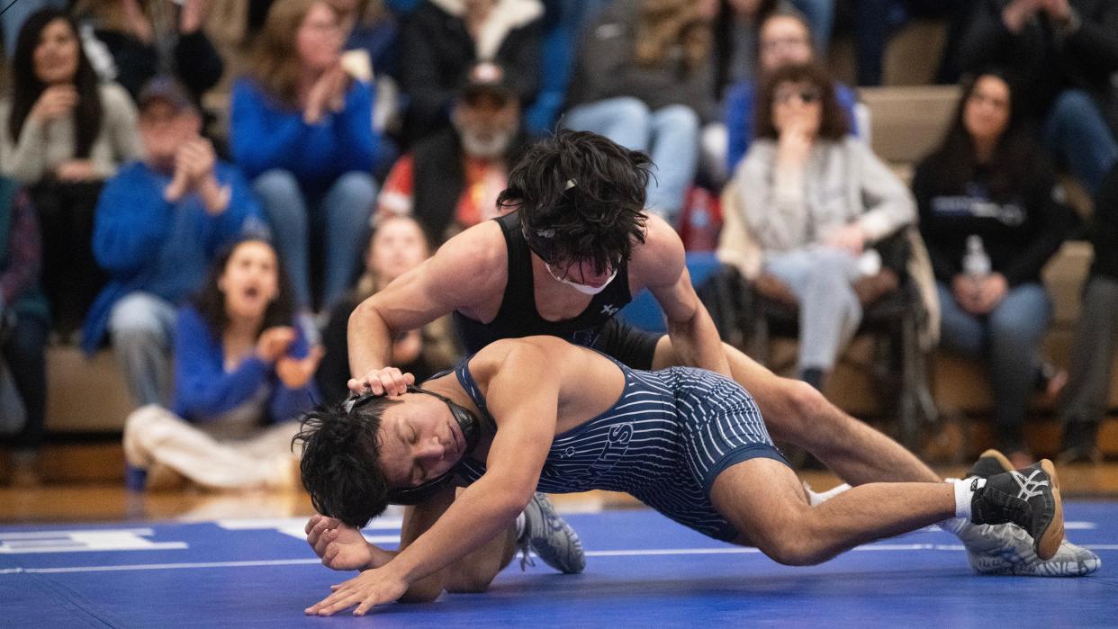 Hammonton's Luca Giagunto controls St. Augustine's Brandon Borman during the 132 lb. bout of the wrestling meet held at Hammonton High School on Wednesday, January 31, 2024. Giagunto defeated Borman, 10-5.