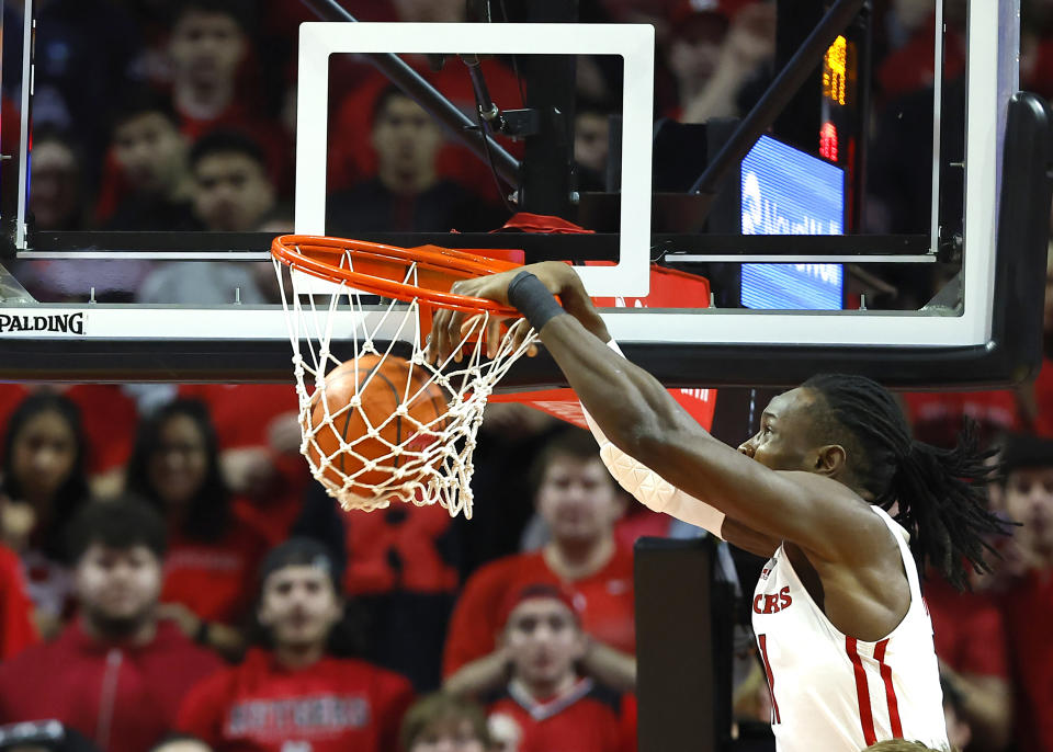Rutgers center Clifford Omoruyi (11) dunks against Wisconsin during the first half of an NCAA college basketball game, Saturday, Feb. 10, 2024, in Piscataway, N.J. (AP Photo/Noah K. Murray)