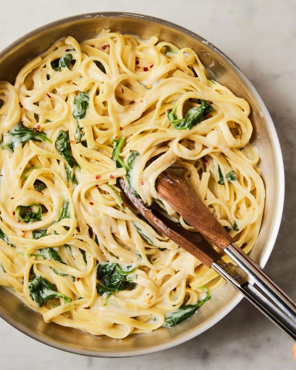 creamy high protein cottage cheese alfredo with spinach and fettuccine