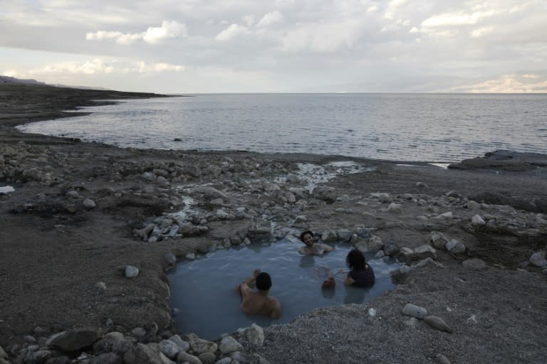 Tourists enjoy a spring water pool along the Dead Sea shore. Experts have warned the Dead Sea is on course to dry out by 2050