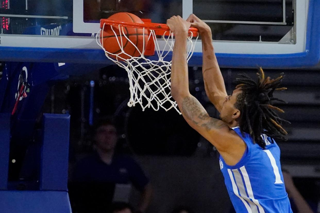 Memphis forward Emoni Bates (1) dunks ion the second half of an NCAA college basketball game against Tulsa, Sunday, Jan. 23, 2022, in Tulsa, Okla. (AP Photo/Sue Ogrocki)